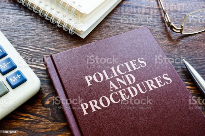 Photo of a policies and procedures book