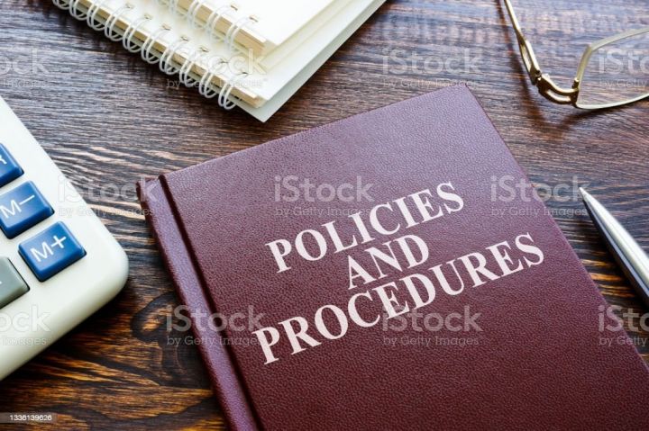 Photo of a policies and procedures book