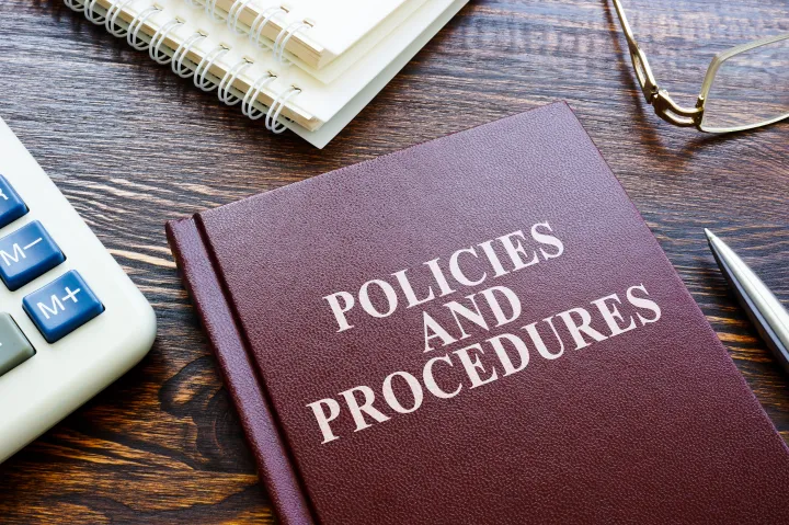 Photo of a policies and procedures book